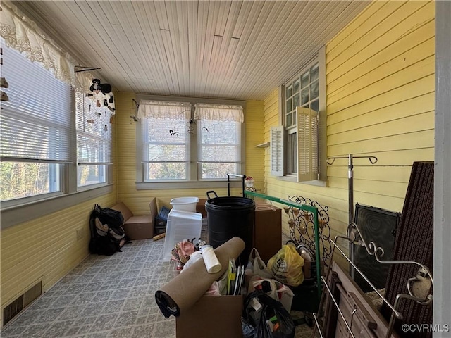 sunroom featuring wooden ceiling and visible vents