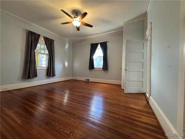 spare room featuring ornamental molding, ceiling fan, baseboards, and hardwood / wood-style flooring