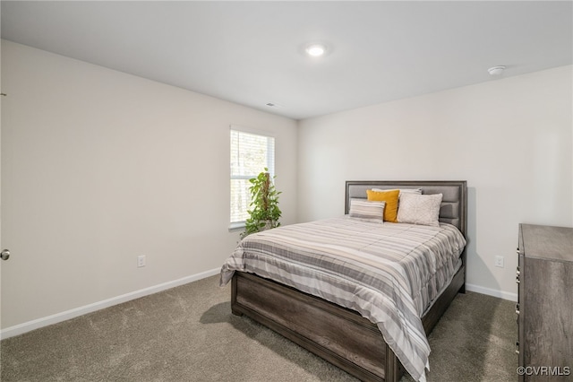 bedroom with carpet and baseboards