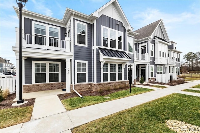 townhome / multi-family property with brick siding and board and batten siding