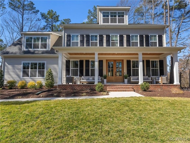 view of front facade with covered porch and a front lawn