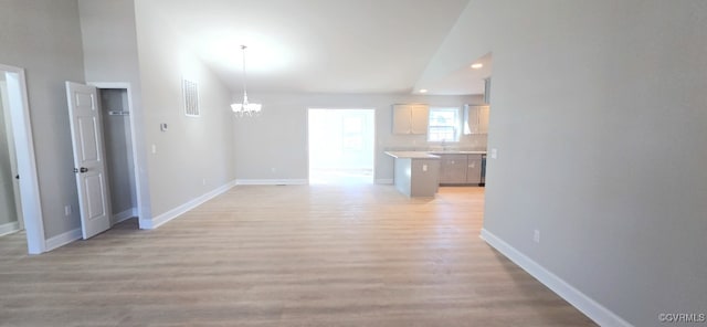 interior space featuring baseboards, visible vents, light wood-style floors, a chandelier, and recessed lighting