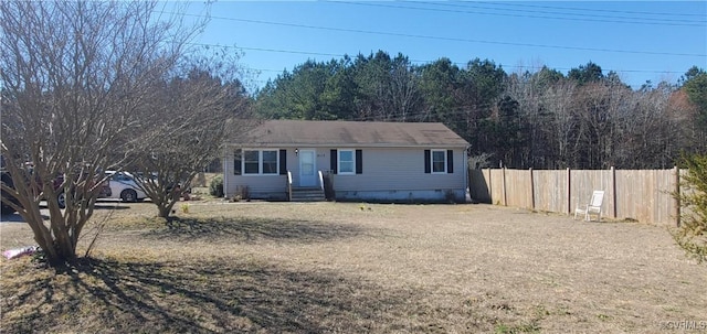 ranch-style home featuring fence and crawl space