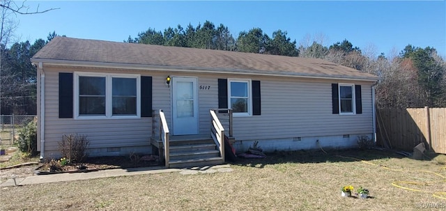 view of front of property featuring a shingled roof, a front yard, fence, and crawl space