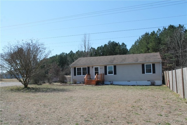 ranch-style home with crawl space, a front lawn, and fence