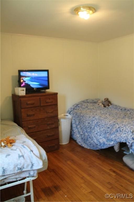 bedroom with wood finished floors