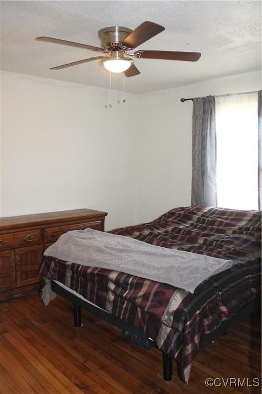bedroom featuring ceiling fan and wood finished floors