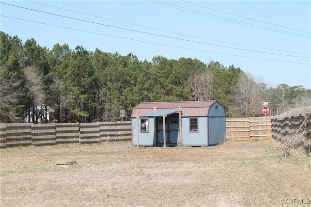 view of shed with a fenced backyard