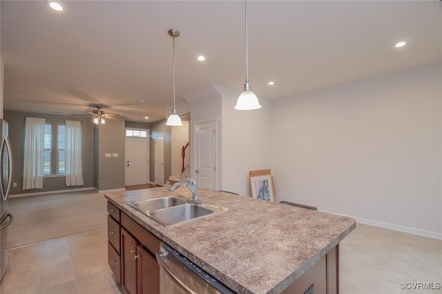 kitchen featuring dishwasher, hanging light fixtures, a sink, and recessed lighting