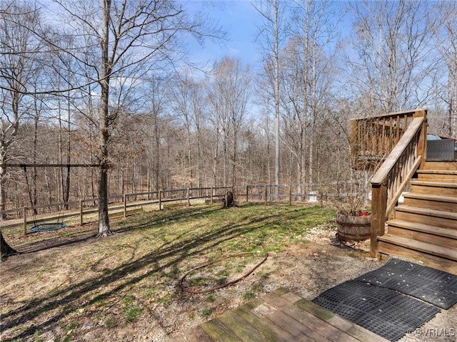 view of yard with stairs and fence