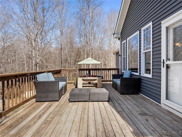 wooden terrace featuring an outdoor living space