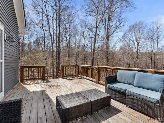 wooden terrace featuring an outdoor hangout area