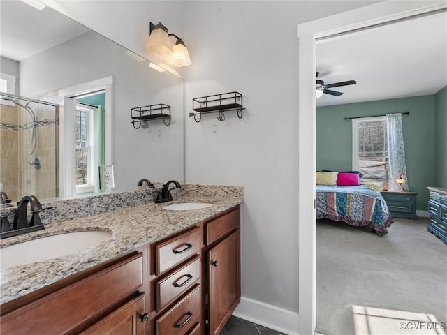 full bathroom with a healthy amount of sunlight and a sink