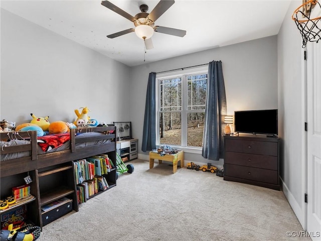 carpeted bedroom featuring a ceiling fan and baseboards