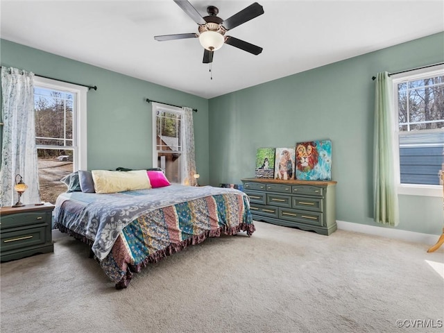 bedroom featuring carpet, baseboards, and ceiling fan