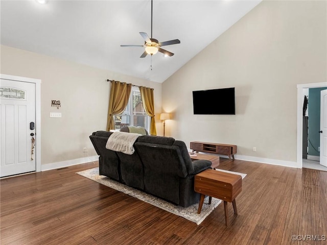 living area featuring high vaulted ceiling, baseboards, a ceiling fan, and wood finished floors