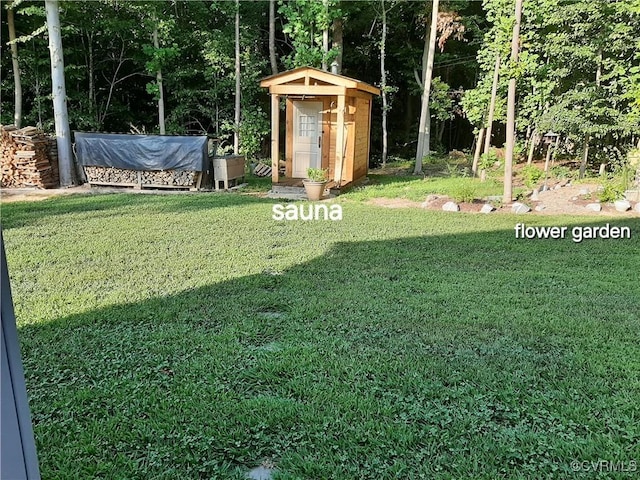 view of yard featuring a storage shed and an outdoor structure