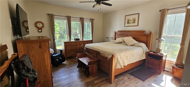 bedroom with ceiling fan and wood finished floors