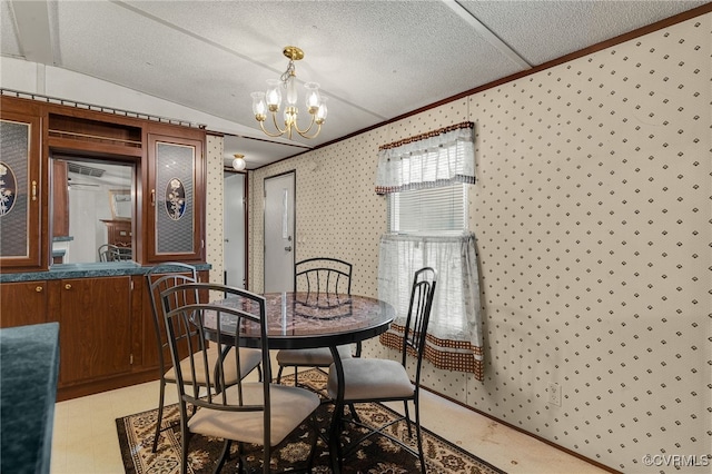 dining area with a textured ceiling, an inviting chandelier, wallpapered walls, light floors, and vaulted ceiling