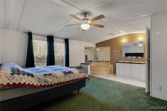 carpeted bedroom featuring a textured ceiling and vaulted ceiling