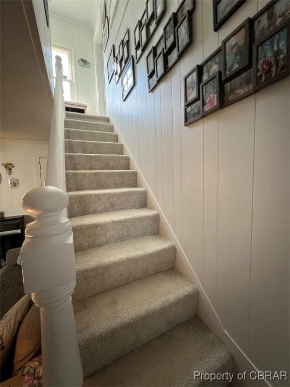 stairway with a decorative wall