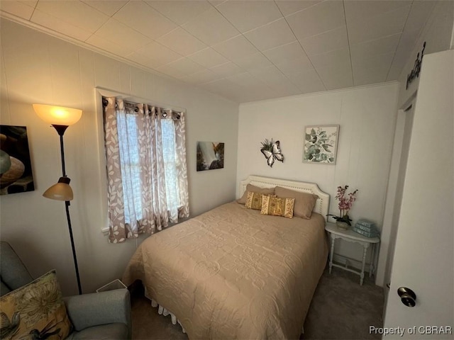 bedroom featuring carpet flooring and crown molding