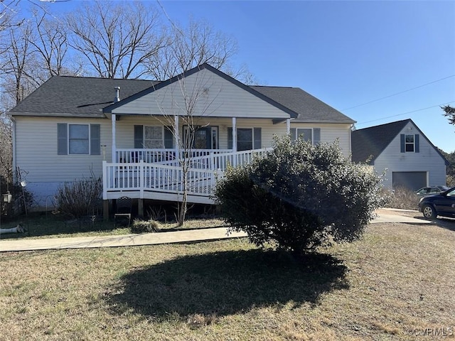 view of front of home with a shingled roof and a porch