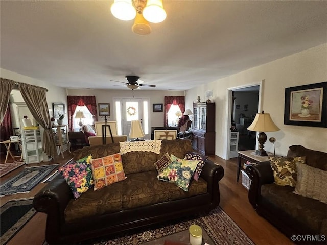 living area featuring wood finished floors and a ceiling fan