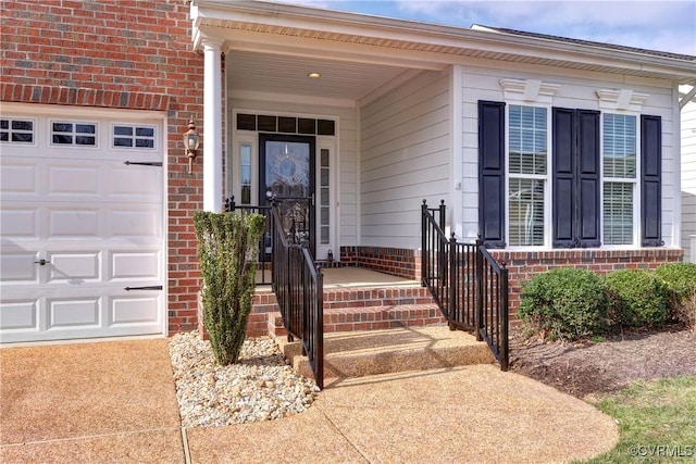 entrance to property featuring brick siding and an attached garage