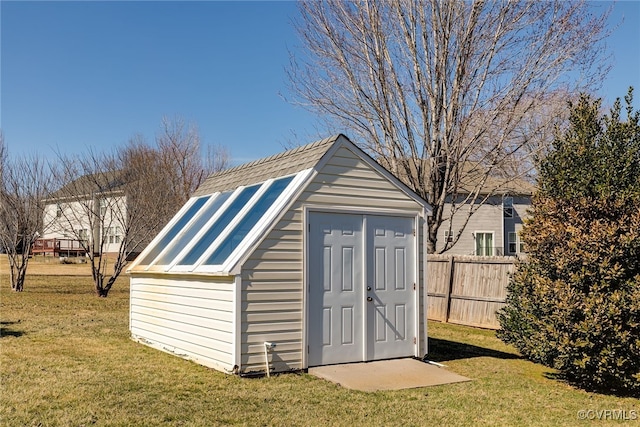 view of shed with fence