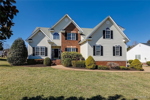 traditional-style home featuring a front lawn