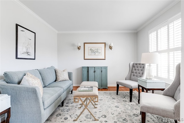 living area featuring ornamental molding, wood finished floors, and baseboards