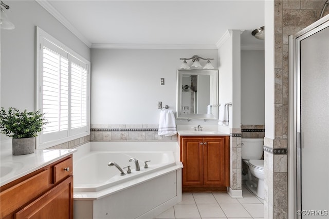 bathroom with tile walls, two vanities, ornamental molding, a sink, and tile patterned flooring