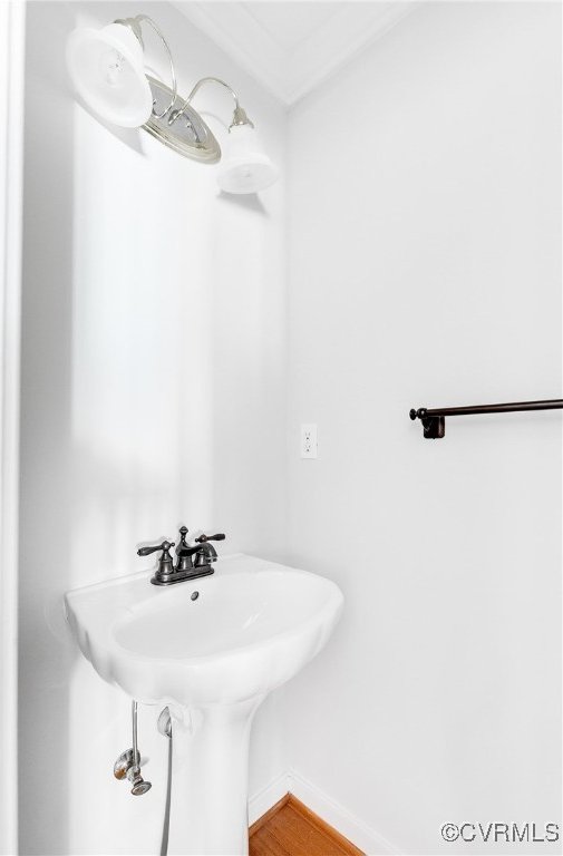 bathroom featuring baseboards and wood finished floors