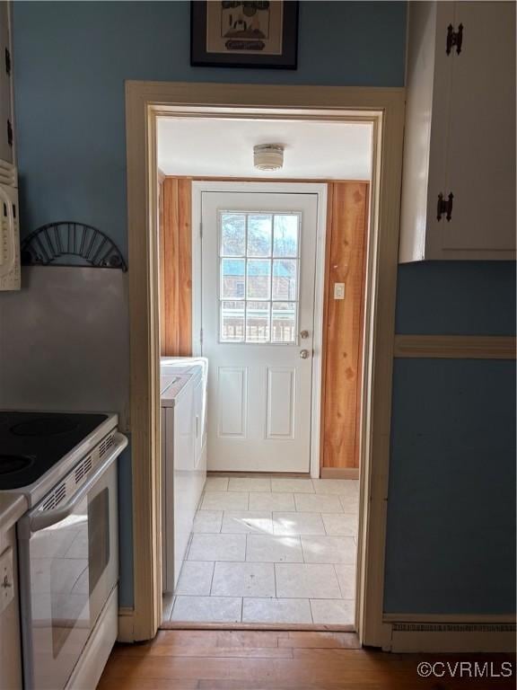 kitchen with white appliances and independent washer and dryer