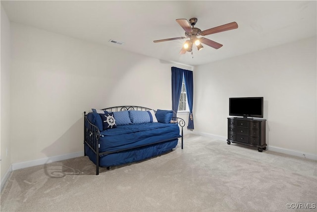 sitting room with carpet flooring, visible vents, and baseboards