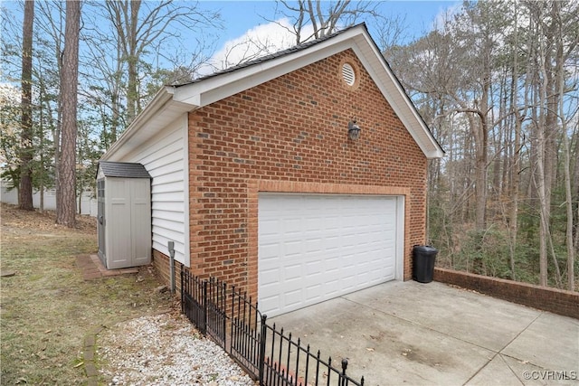 detached garage featuring fence