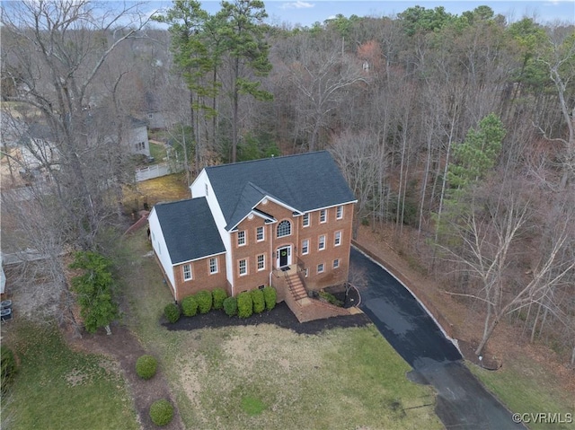 drone / aerial view with a view of trees