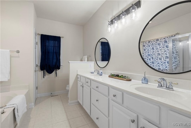 bathroom featuring tile patterned flooring, a shower with curtain, a sink, and toilet