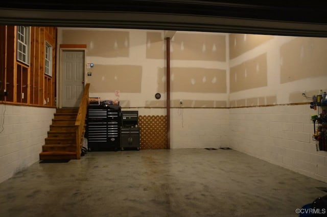 garage with concrete block wall