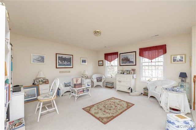 carpeted bedroom featuring visible vents