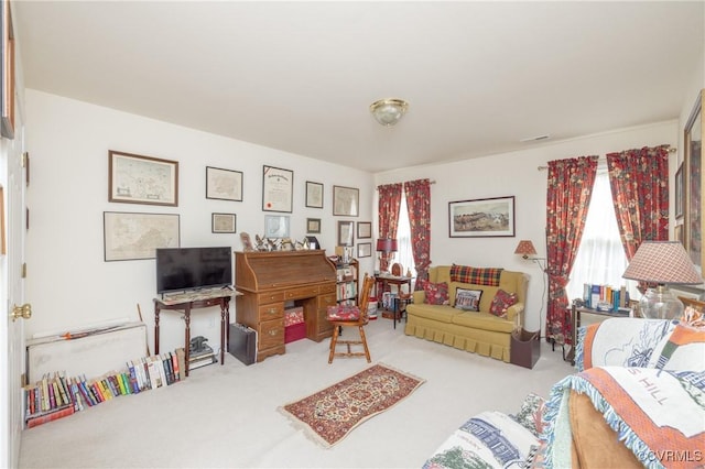 carpeted living area with visible vents