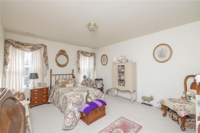 bedroom with carpet and visible vents