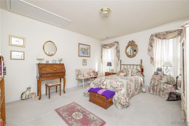 bedroom featuring carpet flooring and attic access