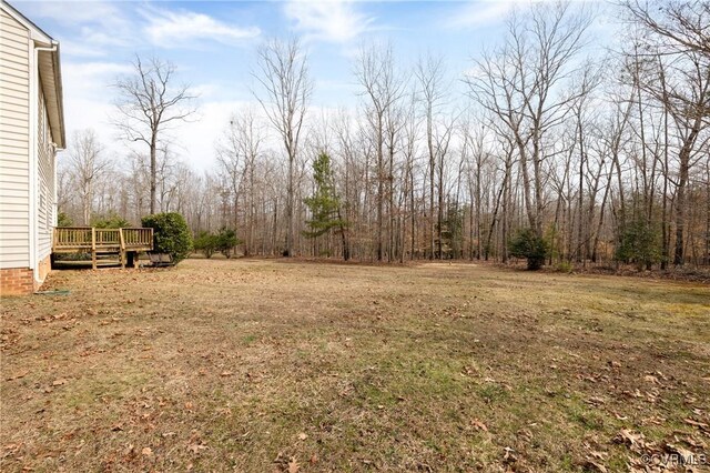 view of yard with a wooden deck