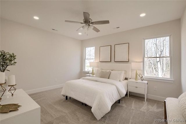 bedroom featuring recessed lighting and light colored carpet