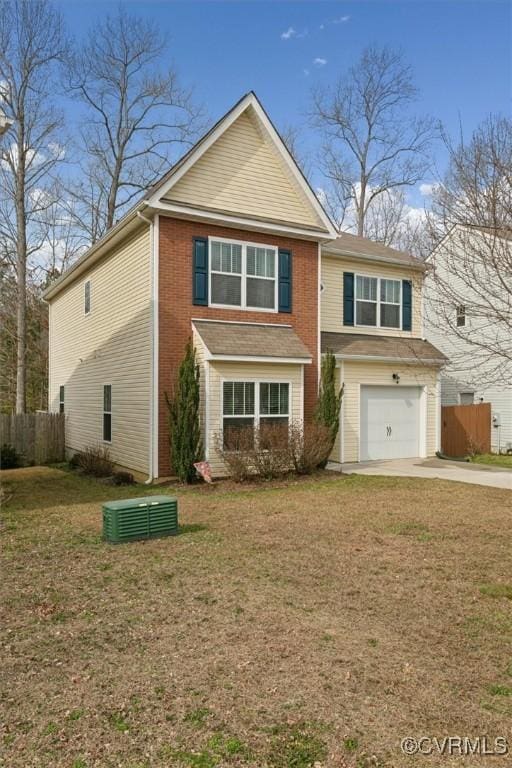 view of front of home featuring concrete driveway, fence, a garage, and a front lawn