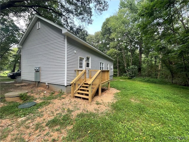 view of property exterior with a lawn