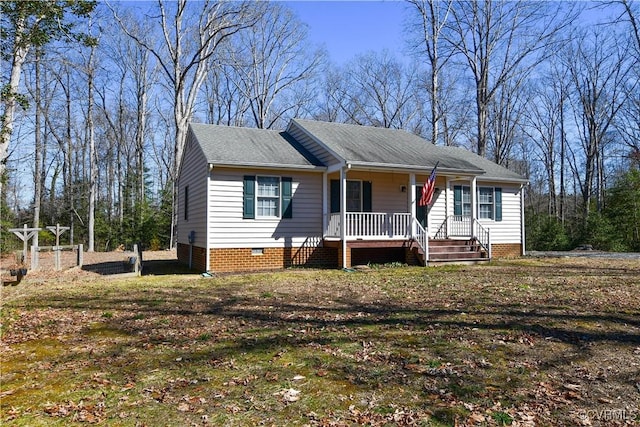 view of front of home with crawl space and covered porch