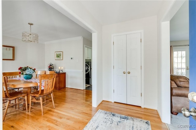 dining room with light wood-style flooring and baseboards